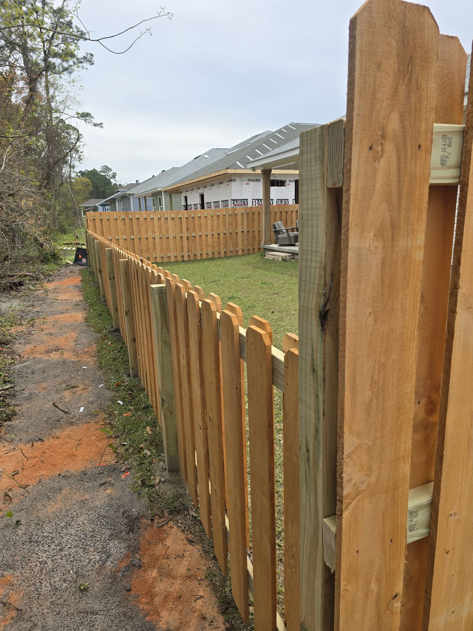 6-foot shadow box Alta Premium wood fencing installation in Myrtle Grove, FL
